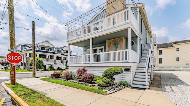 16 E 14th St Unit 1, Ocean City, NJ 08226 - view of front of home featuring stairway, a balcony, and a porch