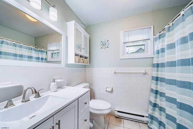 16 E 14th St Unit 1, Ocean City, NJ 08226 - bathroom with a baseboard heating unit, tile walls, vanity, toilet, and tile patterned floors
