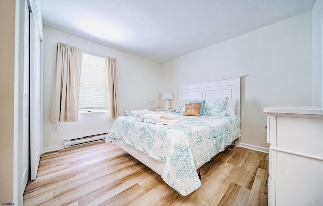 16 E 14th St Unit 1, Ocean City, NJ 08226 - bedroom with a baseboard radiator, wood finished floors, and baseboards