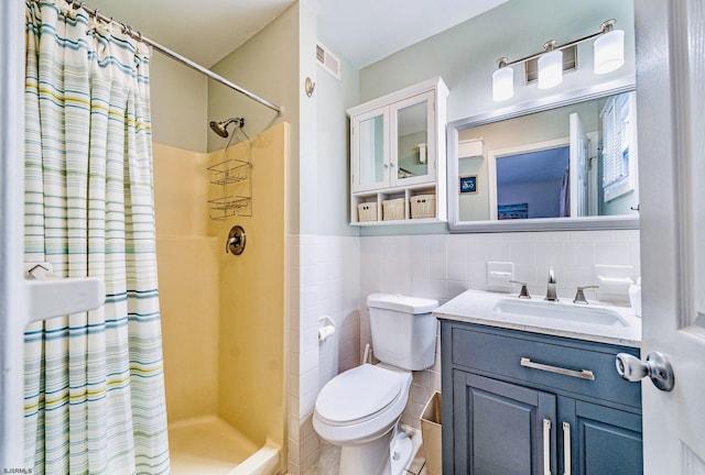 16 E 14th St Unit 1, Ocean City, NJ 08226 - bathroom featuring tile walls, curtained shower, toilet, vanity, and a wainscoted wall