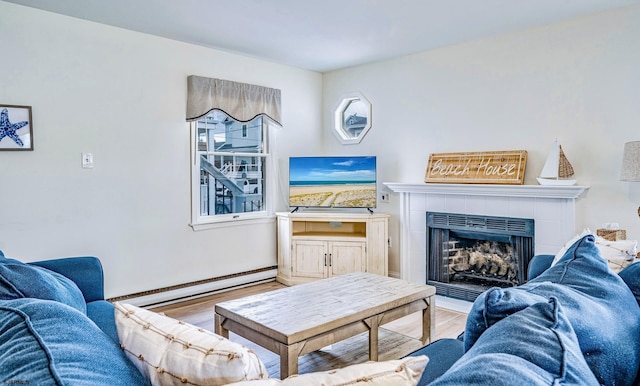16 E 14th St Unit 1, Ocean City, NJ 08226 - living area with a baseboard heating unit, wood finished floors, a tile fireplace, and baseboards