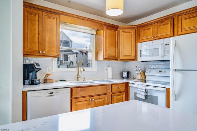 16 E 14th St Unit 1, Ocean City, NJ 08226 - kitchen with white appliances, light countertops, tasteful backsplash, and a sink
