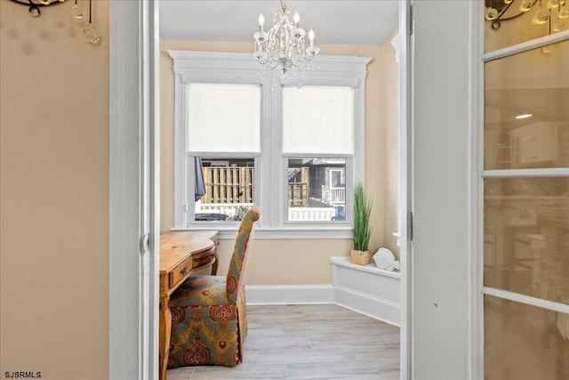 7 N Surrey Ave, Ventnor, NJ 08406 - interior space with a chandelier, healthy amount of natural light, baseboards, and wood finished floors