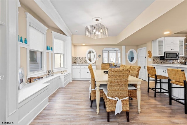 7 N Surrey Ave, Ventnor, NJ 08406 - dining area with healthy amount of natural light, a chandelier, and light wood finished floors