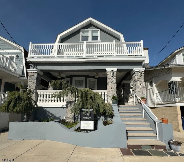 7 N Surrey Ave, Ventnor, NJ 08406 - view of front of property featuring a balcony, ceiling fan, stairs, and covered porch