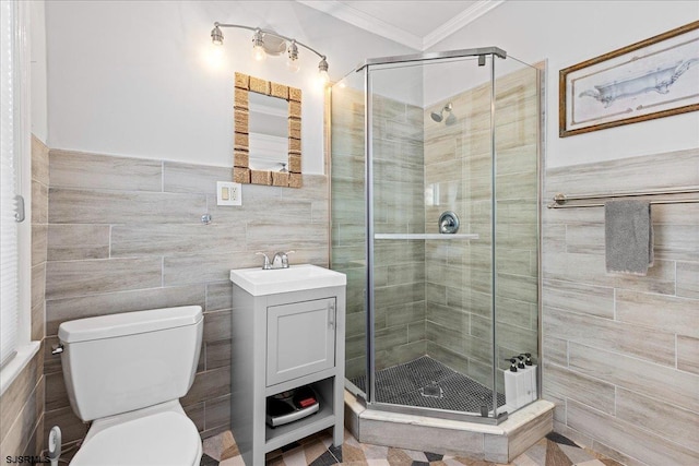 7 N Surrey Ave, Ventnor, NJ 08406 - bathroom featuring ornamental molding, toilet, a stall shower, vanity, and tile walls