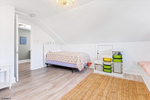 7 N Surrey Ave, Ventnor, NJ 08406 - bedroom with wood finished floors, vaulted ceiling, and baseboards