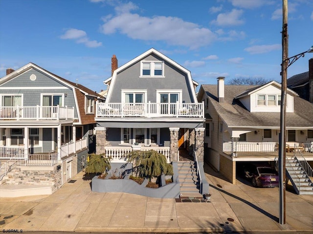 7 N Surrey Ave, Ventnor, NJ 08406 - view of front of property with stairway, a gambrel roof, a porch, and a chimney