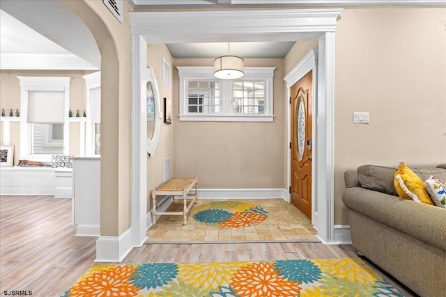 7 N Surrey Ave, Ventnor, NJ 08406 - foyer featuring light wood-style floors, baseboards, and arched walkways