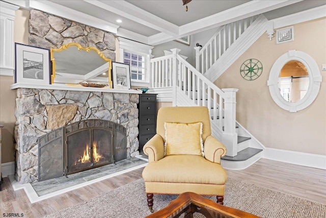 7 N Surrey Ave, Ventnor, NJ 08406 - living area with stairs, wood finished floors, beam ceiling, a fireplace, and baseboards