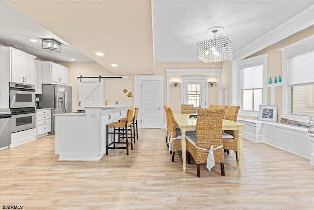 7 N Surrey Ave, Ventnor, NJ 08406 - dining room with a barn door, light wood-style floors, recessed lighting, ornamental molding, and a chandelier