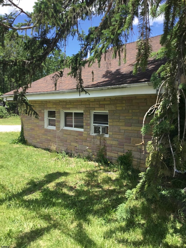 527 E Jimmie Leeds Rd, Galloway Township, NJ 08205 - view of property exterior with a lawn, stone siding, and roof with shingles