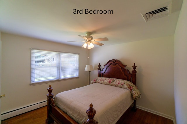 2044 Cedarbridge Rd, Northfield, NJ 08225 - bedroom featuring a baseboard radiator, wood finished floors, a ceiling fan, and baseboards