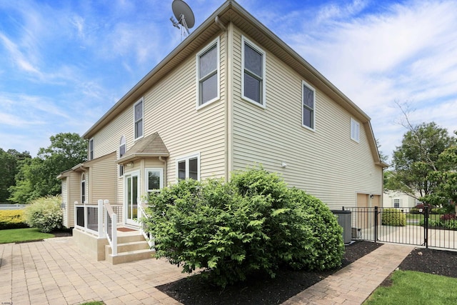 102 Camellia Ln, Egg Harbor Township, NJ 08234 - view of home's exterior featuring an attached garage and central AC