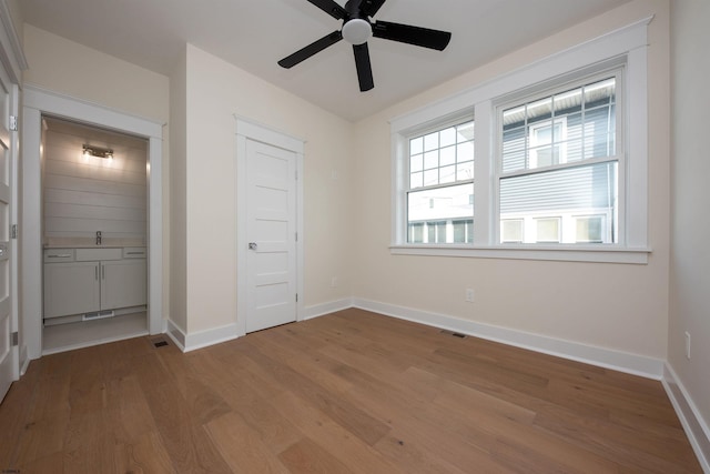632A Ocean Ave Unit 1, Ocean City, NJ 08226 - unfurnished bedroom featuring wood finished floors, baseboards, and a ceiling fan