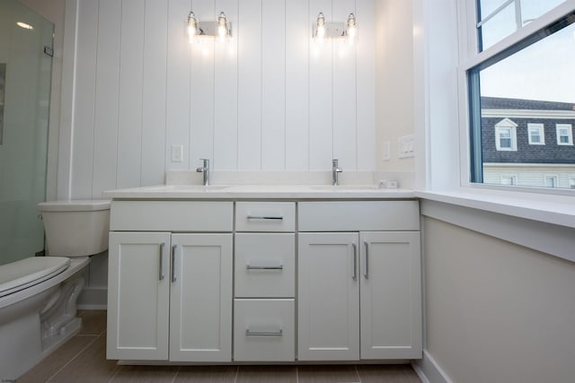 632A Ocean Ave Unit 1, Ocean City, NJ 08226 - full bathroom with toilet, double vanity, a shower with shower door, and baseboards