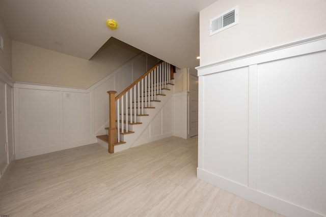 632A Ocean Ave Unit 1, Ocean City, NJ 08226 - stairway featuring a decorative wall and wood finished floors