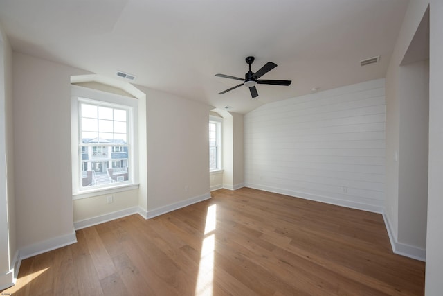632A Ocean Ave Unit 1, Ocean City, NJ 08226 - unfurnished room featuring vaulted ceiling, ceiling fan, wood finished floors, baseboards, and wooden walls