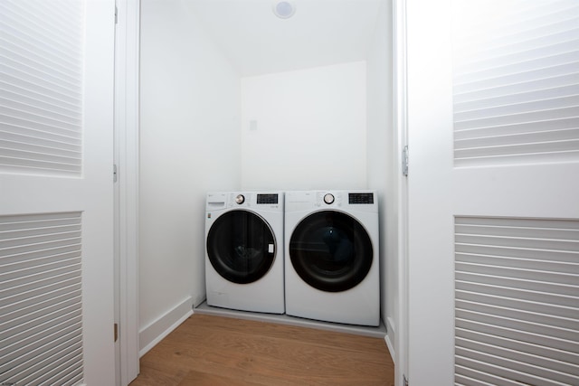 632A Ocean Ave Unit 1, Ocean City, NJ 08226 - washroom featuring washer and dryer and wood finished floors