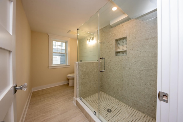 632A Ocean Ave Unit 1, Ocean City, NJ 08226 - bathroom featuring a shower stall, toilet, baseboards, wood finished floors, and recessed lighting