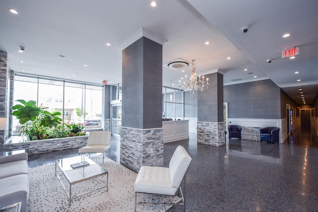 9400 Atlantic Ave Unit 305, Margate, NJ 08402 - lobby with wainscoting, recessed lighting, ornamental molding, a surveillance system, and expansive windows