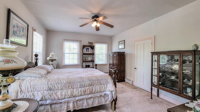 1607 Somers Point Rd, Egg Harbor Township, NJ 08234 - bedroom with baseboard heating, light carpet, multiple windows, and ceiling fan