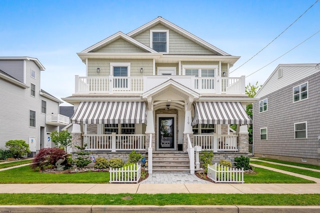 119 N Kenyon Ave, Margate, NJ 08402 - view of front facade featuring a balcony, a porch, and stone siding