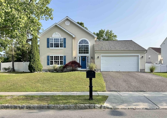 243 Churchill Dr, Egg Harbor Township, NJ 08234 - traditional-style home with a garage and asphalt driveway