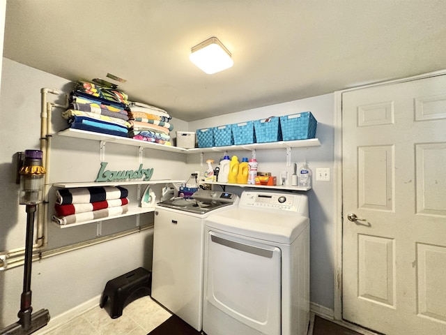 243 Churchill Dr, Egg Harbor Township, NJ 08234 - laundry room with washing machine and clothes dryer, baseboards, and tile patterned floors