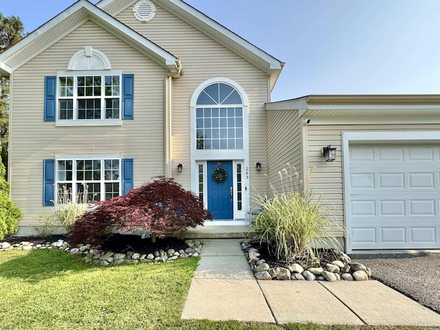 243 Churchill Dr, Egg Harbor Township, NJ 08234 - traditional-style home with an attached garage and a front lawn