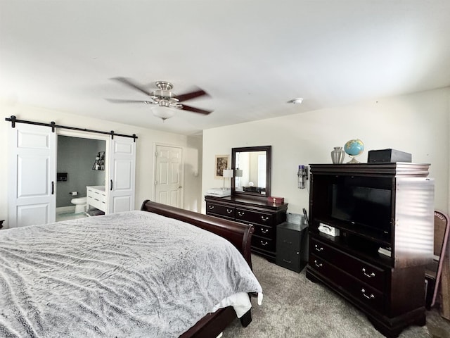243 Churchill Dr, Egg Harbor Township, NJ 08234 - carpeted bedroom with a barn door, connected bathroom, and ceiling fan