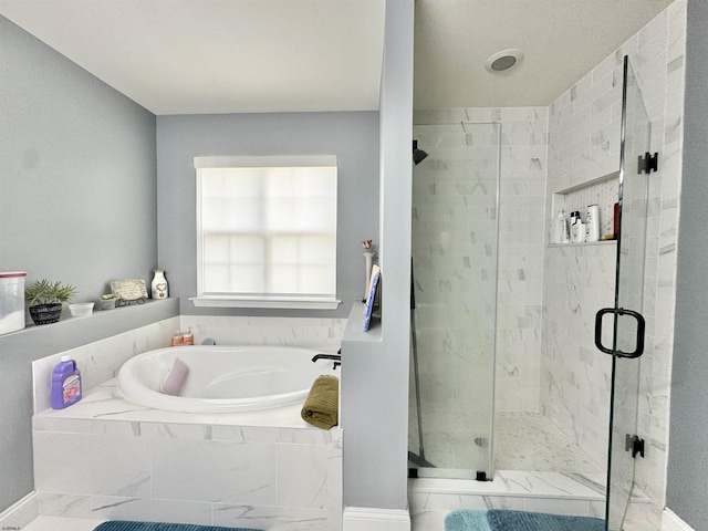 243 Churchill Dr, Egg Harbor Township, NJ 08234 - bathroom with a bath, a stall shower, and baseboards