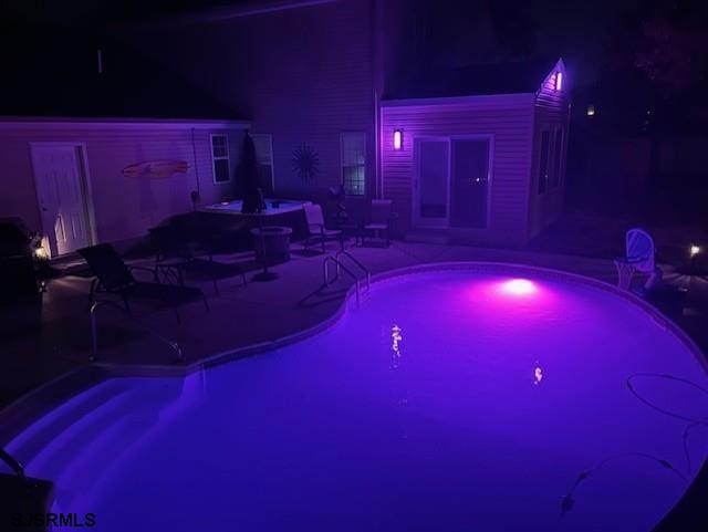 243 Churchill Dr, Egg Harbor Township, NJ 08234 - pool at twilight featuring a patio area and an outdoor pool