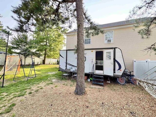 243 Churchill Dr, Egg Harbor Township, NJ 08234 - rear view of house featuring entry steps and a playground