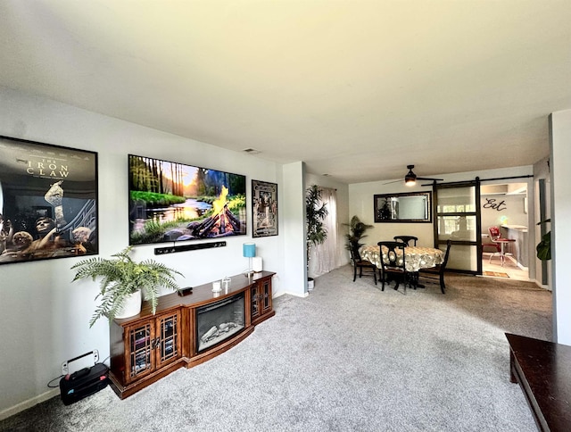 243 Churchill Dr, Egg Harbor Township, NJ 08234 - living area featuring carpet flooring, a ceiling fan, and baseboards
