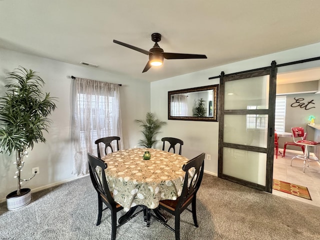 243 Churchill Dr, Egg Harbor Township, NJ 08234 - dining space with a barn door, carpet flooring, ceiling fan, and baseboards