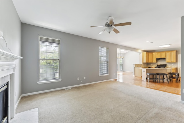 15 Gallant Fox Ln, Egg Harbor Township, NJ 08234 - unfurnished living room featuring light colored carpet, a ceiling fan, baseboards, and a fireplace