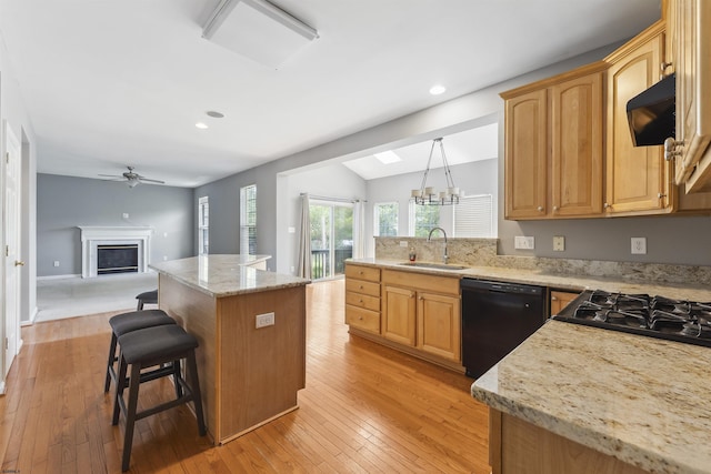 15 Gallant Fox Ln, Egg Harbor Township, NJ 08234 - kitchen with black dishwasher, a sink, range hood, light wood finished floors, and plenty of natural light