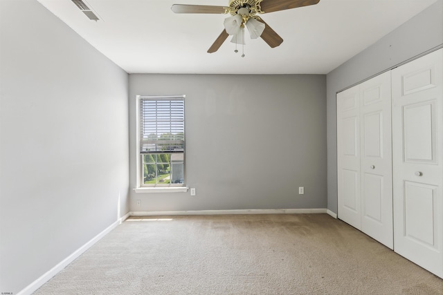 15 Gallant Fox Ln, Egg Harbor Township, NJ 08234 - unfurnished bedroom featuring carpet flooring, a closet, baseboards, and a ceiling fan