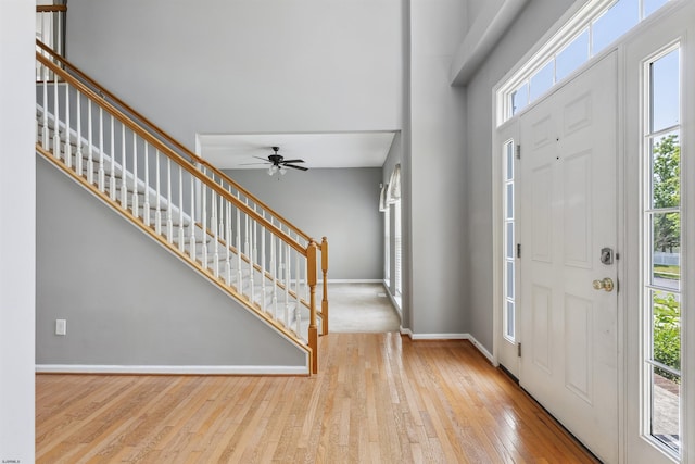 15 Gallant Fox Ln, Egg Harbor Township, NJ 08234 - entryway with stairway, hardwood / wood-style flooring, ceiling fan, baseboards, and a high ceiling