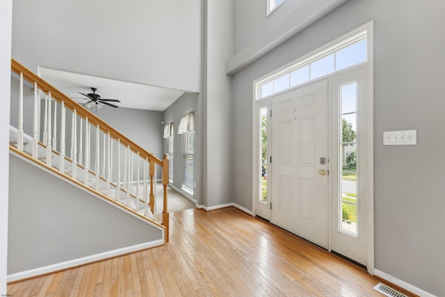 15 Gallant Fox Ln, Egg Harbor Township, NJ 08234 - entrance foyer with a towering ceiling, hardwood / wood-style flooring, stairway, ceiling fan, and baseboards