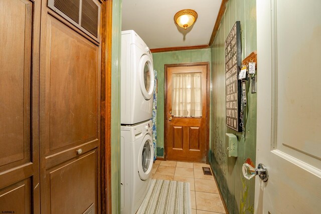 5 Edward Ter, Upper Township, NJ 08230 - laundry room featuring stacked washing machine and dryer, light tile patterned flooring, and ornamental molding