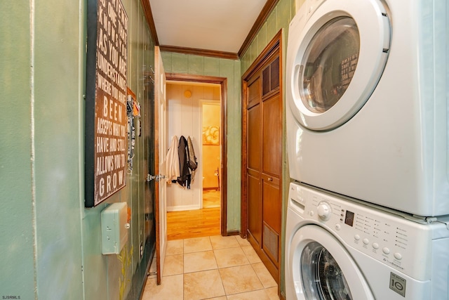 5 Edward Ter, Upper Township, NJ 08230 - laundry room with stacked washer and clothes dryer, cabinet space, crown molding, light tile patterned flooring, and baseboards