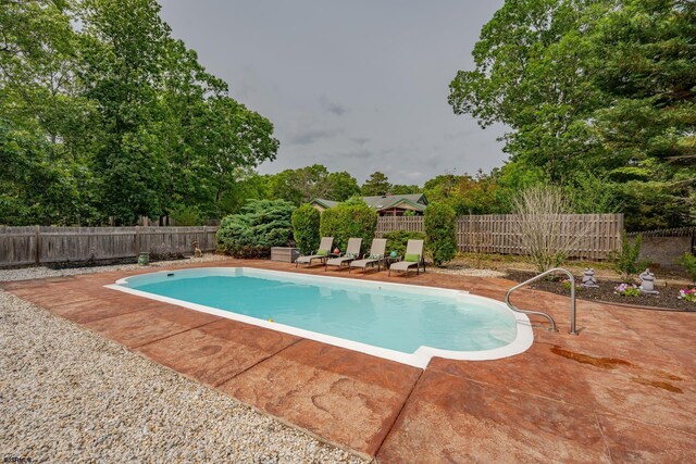 5 Edward Ter, Upper Township, NJ 08230 - view of swimming pool with a patio, a fenced backyard, and view of scattered trees