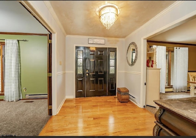 5 Edward Ter, Upper Township, NJ 08230 - entryway with a baseboard radiator, a chandelier, light wood-style flooring, crown molding, and baseboard heating