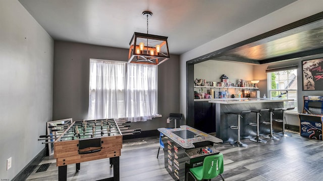 206 Branch Hill Dr, Egg Harbor Township, NJ 08234 - game room featuring a chandelier, a bar, and wood finished floors