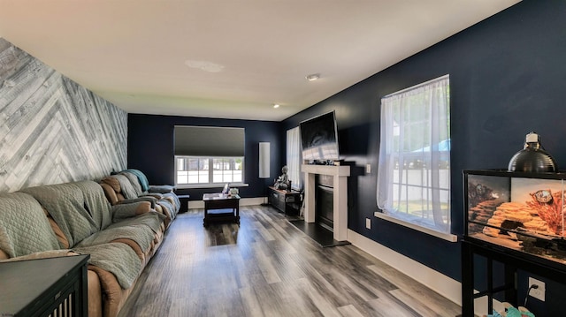 206 Branch Hill Dr, Egg Harbor Township, NJ 08234 - living area with an accent wall, wood finished floors, a fireplace with raised hearth, and baseboards