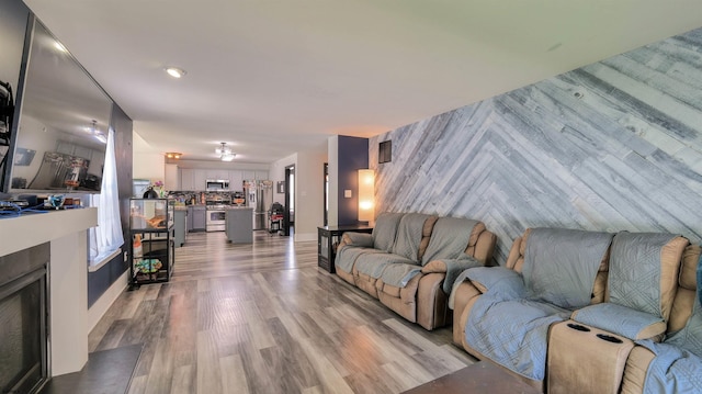 206 Branch Hill Dr, Egg Harbor Township, NJ 08234 - living area featuring a fireplace with flush hearth and light wood-style flooring
