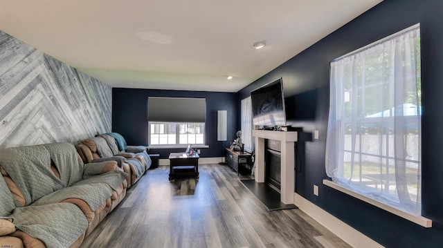 206 Branch Hill Dr, Egg Harbor Township, NJ 08234 - living room with an accent wall, a glass covered fireplace, baseboards, dark wood-style floors, and wallpapered walls