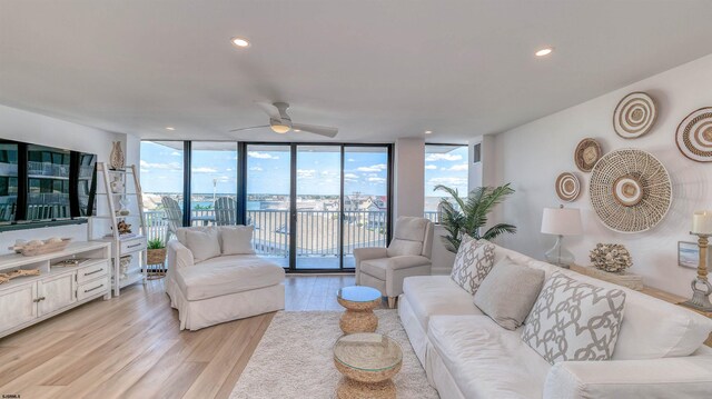 111 S 16th Ave Unit 510, Longport, NJ 08403 - living room with light wood-type flooring, expansive windows, plenty of natural light, ceiling fan, and recessed lighting